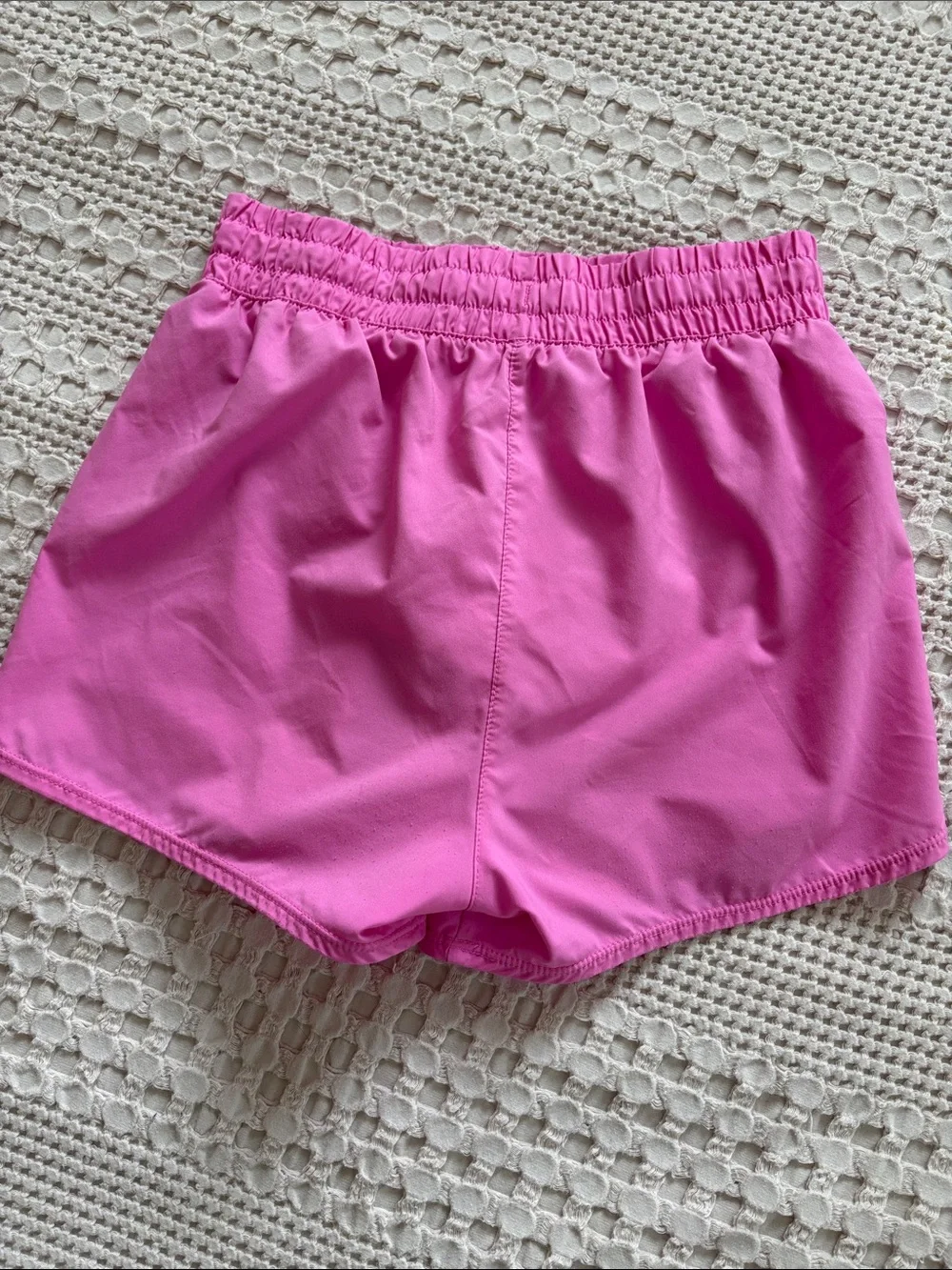 Nike Girl’s Pink Athletic Shorts with White Swoosh